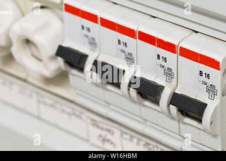 Electric circuit breaker fuse box in private home close up with selective focus Stock Photo