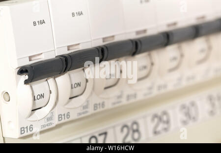 Electric circuit breaker fuse box in private home close up with selective focus Stock Photo