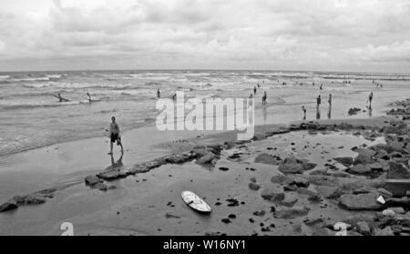 Storm is coming and the waves get bigger, a great time to surf along the Gulf of Mexico. Taken along the beaches in Galveston, Texas in early September.   Never got to be a hurricaine, just another tropical storm. Stock Photo