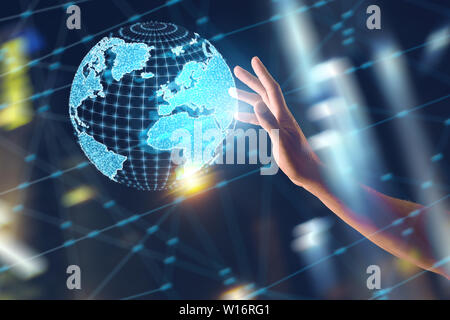 Female hand with digital model of Earth on dark background Stock Photo