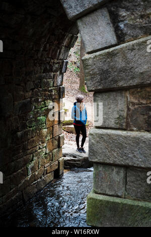 Woman Under Bridge Stock Photo