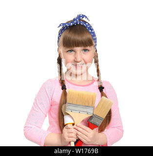 Cute little girl with brushes on white background Stock Photo