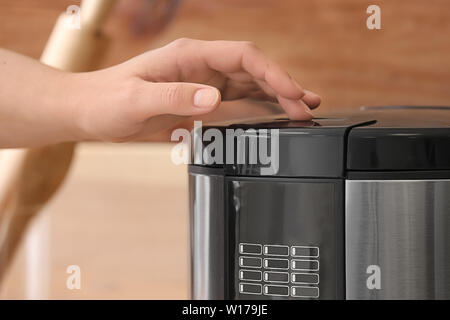 Woman cleaning modern multi cooker in kitchen Stock Photo - Alamy