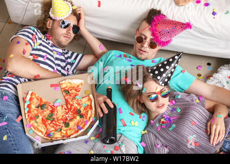 Young people sleeping after party at home Stock Photo