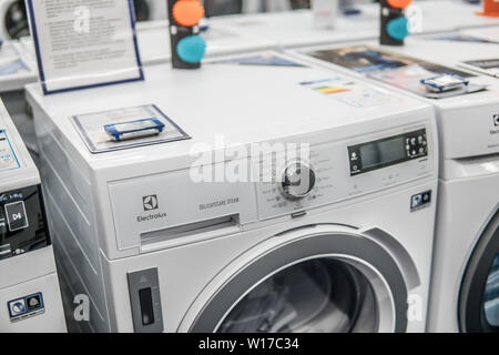 Lodz, Poland, July 2018 inside Saturn electronic store, free-standing Electrolux dryer washing machine on display for sale, produced by Electrolux, Stock Photo