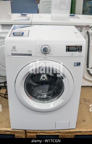Lodz, Poland, July 2018 inside Saturn electronic store, free-standing Electrolux dryer washing machine on display for sale, produced by Electrolux, Stock Photo