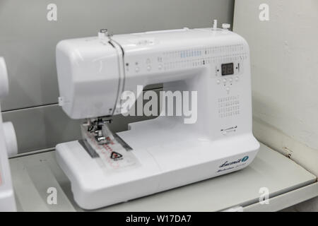 Lodz, Poland, July 9, 2018 inside Saturn electronic store, Sewing Machine Lucznik on display for sale Stock Photo