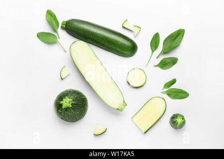 Cut zucchini squashes on white background Stock Photo