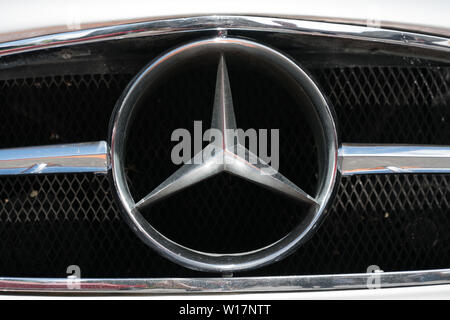 Bad Ragaz, SG / Switzerland - 23 June, 2019: extra large Mercedes Benz radiator logo on an old timer sports car up close at the Heidiland Classic Car Stock Photo