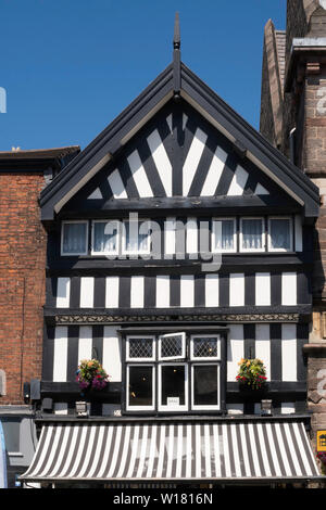 A half timbered building next to Congleton town hall in the High Street, Cheshire, England, UK Stock Photo