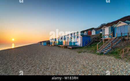 Rows of beach huts at Milford on Sea on the Hampshire coast Stock Photo