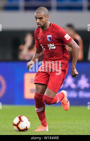 Brazilian football player Alan Douglas Borges de Carvalho, simply known as Alan, of Tianjin Tianhai dribbles against Jiangsu Suning in their 15th round match during the 2019 Chinese Football Association Super League (CSL) in Tianjin, China, 30 June 2019. Jiangsu Suning played draw to Tianjin Tianhai 2-2. Stock Photo