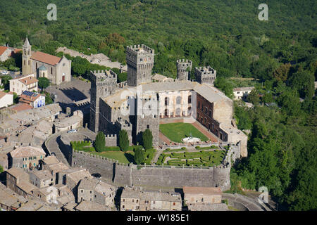 AERIAL VIEW. Medieval castle of Torre Alfina crowning the old village. Province of Viterbo, Lazio, Italy. Stock Photo