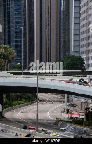 Hong Kong, China. 01st July, 2019. Empty blocked streets as confrontation between protesters and police persists. Thousands of anti government protesters faced off with riot police and occupy major roads around the Hong Kong government complex during the 22nd anniversary of Hong Kong return to Chinese rule. Credit: SOPA Images Limited/Alamy Live News Stock Photo