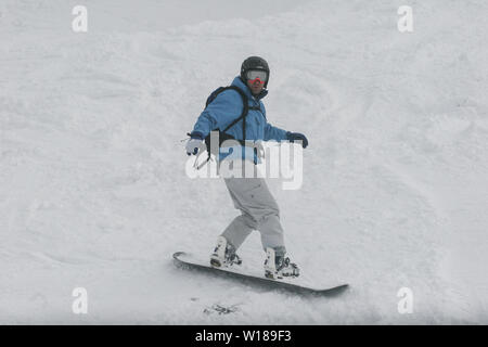 SIBIU, ROMANIA - March 13, 2010: Male snowboarder in the Fagaras mountains Stock Photo