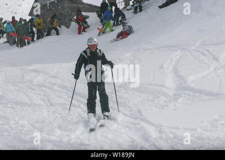 SIBIU, ROMANIA - March 13, 2010: Male skier skiing downhill. Stock Photo