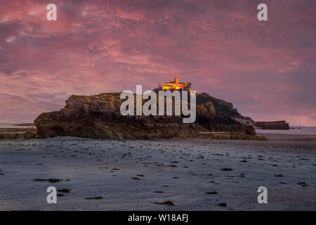 st. michael's mount with the castle and church Cornwall at sunset Stock Photo