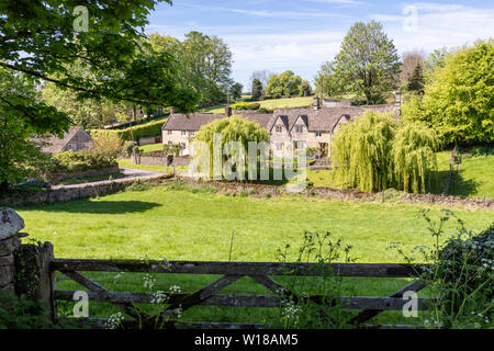 Maytime in the Cotswolds - Stone cottages in the village of Hampnett, Gloucestershire UK Stock Photo
