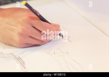 Female hand drawn on white paper Stock Photo