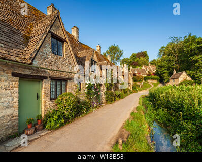 Row of 600 year old English Cotswolds stone cottages. Arlington Row ...