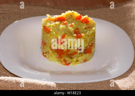 Plate of Uzbek pilaf with lamb on a canvas napkin Stock Photo