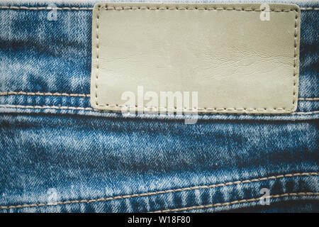 Empty leather label on jeans background with copy space Stock Photo