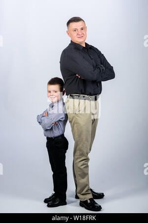 team work. happy child with father. business partner. childhood. parenting. fathers day. family day. father and son in business suit. little boy with dad businessman. great team work. Stock Photo