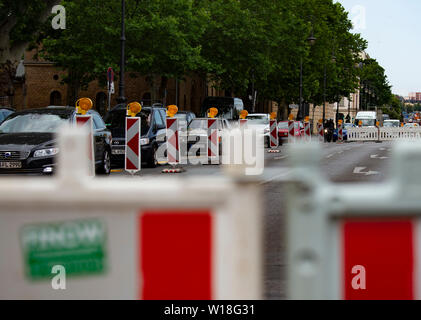 Berlin, Germany. 01st July, 2019. Barrier grids are located at Spandauer Damm, preventing turning off in the direction of the castle bridge. Since the morning, workers have been preparing the new traffic routing so that the castle bridge can be renovated. The ageing building is to be renovated in the next eight weeks. The bridge is therefore completely closed to traffic. Credit: Paul Zinken/dpa/Alamy Live News Stock Photo