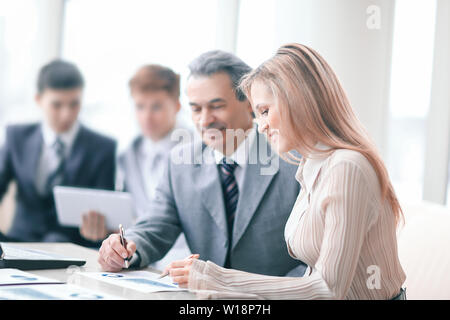 businessman and assistant in the workplace in the office. Stock Photo