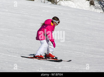 The central Pyrenees at Pont Espagne. Young boy learning to ski on the beginners slope.No sticks. Stock Photo