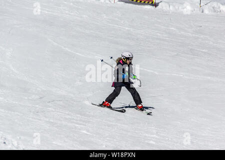 The central Pyrenees at Pont Espagne. Young girl learning to ski.two sticks. Stock Photo