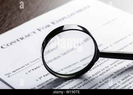 Magnifying Glass and document close up Stock Photo