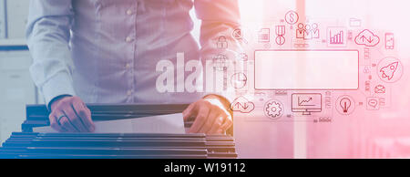 Businesswoman accessing archive storage and user interface flowchart with business and technology icons: online backup, cloud and database  concept Stock Photo