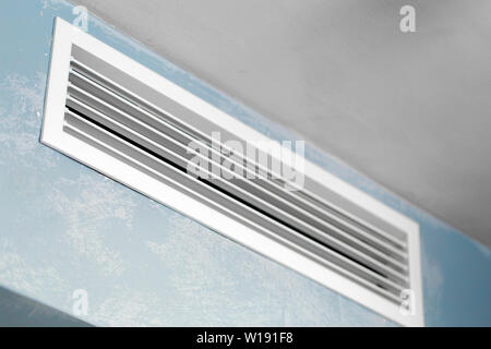 Close up of vent on the wall. Plastic ventilation grid, piece of home ventilation system. Stock Photo
