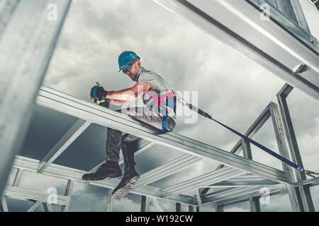 Construction Steel Skeleton Frame Worker Safety Harness Theme. Residential and Commercial Building.