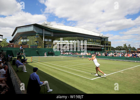 A general view of the match between Monica Puig and Anna Karolina Schmiedlova on day one of the Wimbledon Championships at the All England Lawn Tennis and Croquet Club, London. Stock Photo