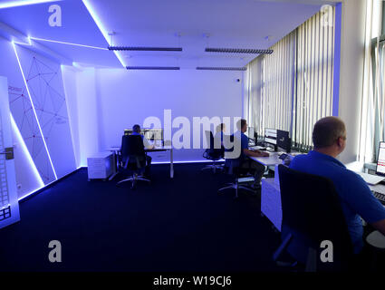 Essen, Germany. 01st July, 2019. In the 'Blue Room', Innogy employees practice defending against cyber attacks on the power grid during a simulation. The energy company Innogy presents its training center for the defense against cyber attacks on power grids. Credit: Roland Weihrauch/dpa/Alamy Live News Stock Photo