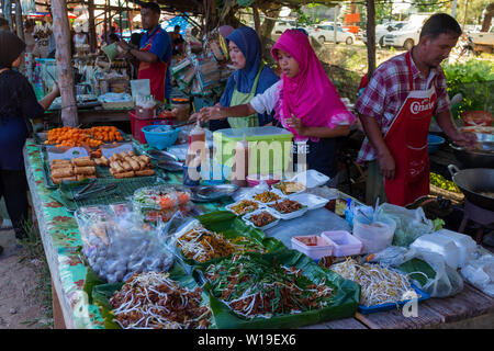 Saladan, Koh Lanta, March, 19, 2018: Gorgeous looking fresh spices on a market stall at a mostly muslim food market on Koh Lanta, several men and wome Stock Photo