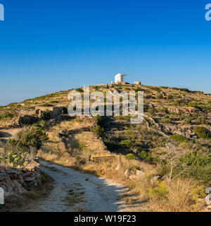 Beautiful greeek countryside landscape with traditional cycladic windmill on Paros island, Greece Stock Photo