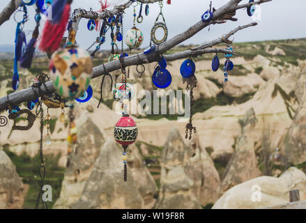 Traditional Turkish amulets and decorations hang on the branches