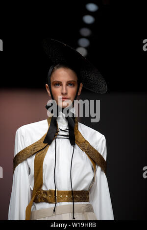 Berlin, Germany. 01st July, 2019. A model presents the fashion of the designer Danny Reinke in the E-Werk. The collections for Spring/Summer 2020 will be presented at Berlin Fashion Week. Credit: Monika Skolimowska/dpa/Alamy Live News Stock Photo