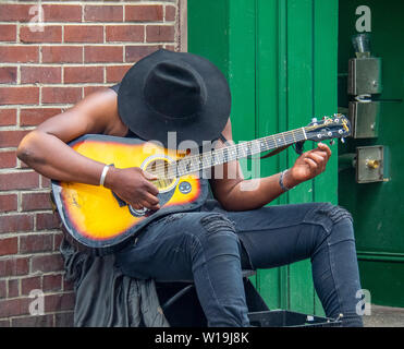 African American male guitarist busking in Nashville Tennessee, USA. Stock Photo