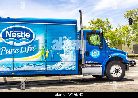 June 25, 2019 Sunnyvale / CA / USA - Nestle branded truck travelling through a city in south San Francisco bay area Stock Photo
