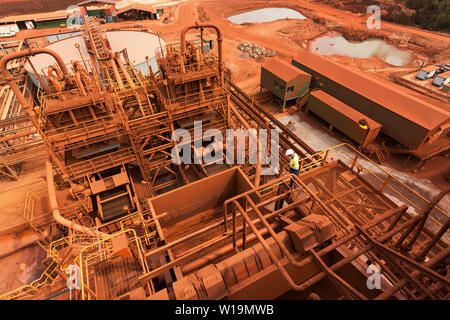 Mining operations for transporting and managing iron ore. View down over haematite process plant at dewatering screens and across to thickener tanks. Stock Photo