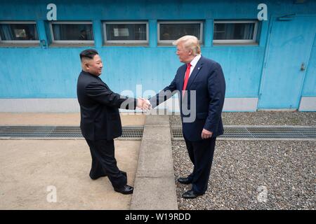 Panmunjom, South Korea. . 30th June, 2019. U.S President Donald Trump and North Korean leader Kim Jong Un shake hands as they meet at the border in the Demilitarized Zone June 30, 2019 in Panmunjom, South Korea. Credit: Planetpix/Alamy Live News Stock Photo