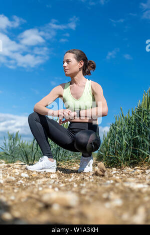 woman jogger checking her smart watch Stock Photo