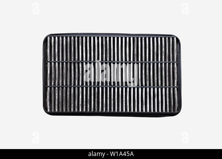 The bottom side of the dirty car air filter with dust isolated on white background with clipping path. Automotive services maintenance. Stock Photo