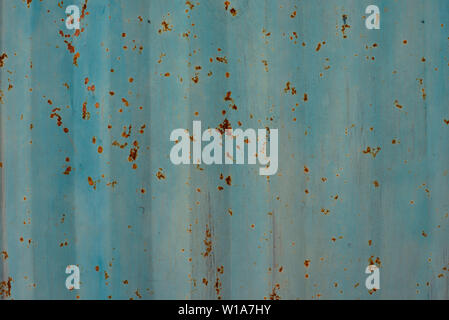 Light blue / duck egg painted metal wall texture background. Stripy grunge / grungy, corroding surface. Stock Photo
