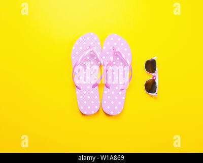 Summer flat lay. Pink flip flops, sunglasses. Summer trevel and vacation concept Stock Photo