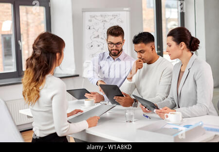 team of recruiters with tablet pc at job interview Stock Photo